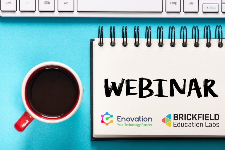 Webinar' is written on a notepad with Enovation and Brickfield Education Labs logo, beside a mug of black coffee and a keyboard.