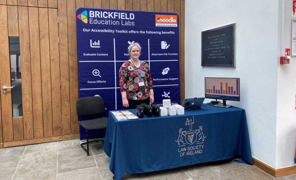Karen Holland standing on our stand at the Law Society Edtech 2023 Conference.