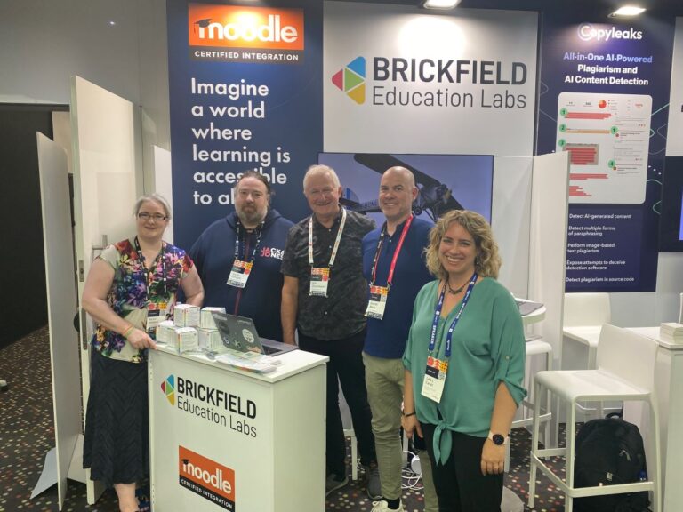 Our Brickfield team on the stand at GlobalMoot 2023, with Karen Holland, Gavin Henrick, Mike Churchward, Garnet Berry and Laia Canet